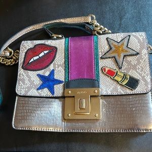Aldo crossbody with unique & cool lips, lipstick, and stars appliqués